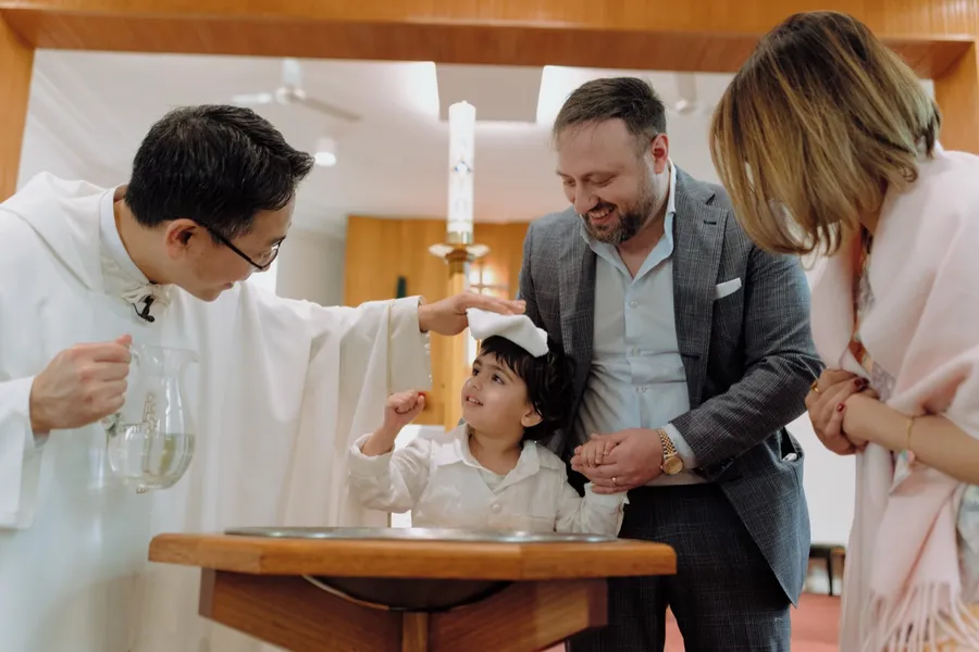 A family gathered for a christening.