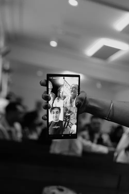 A candle handover during a christening ceremony.